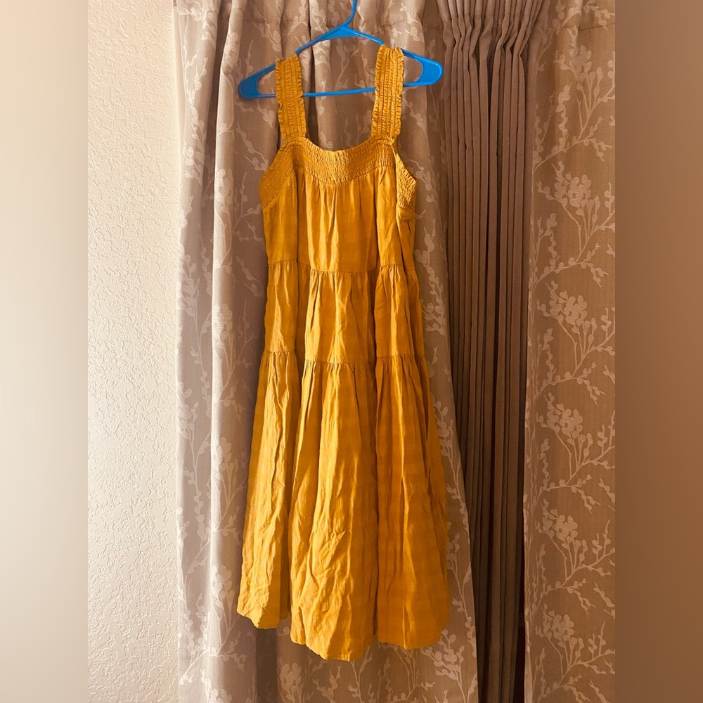 Yellow-gold maxi dress.